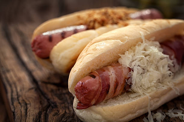 istock Hot dogs on wooden table with copy space 583990202