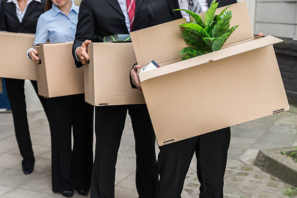 istock Businesspeople With Cardboard Boxes 583990402