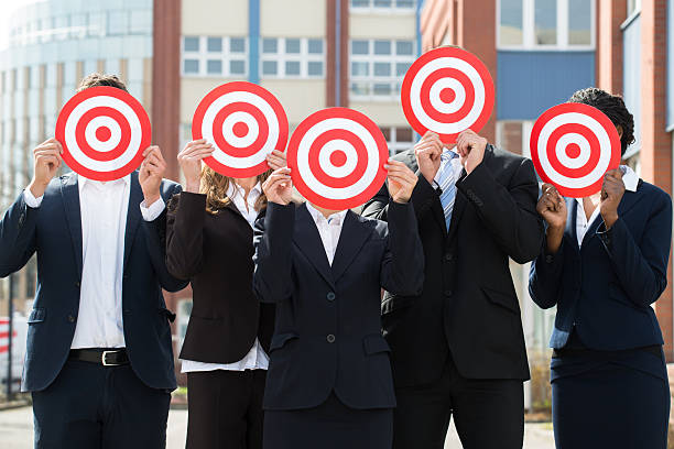istock Businesspeople Hiding Face With Dartboard 583991066