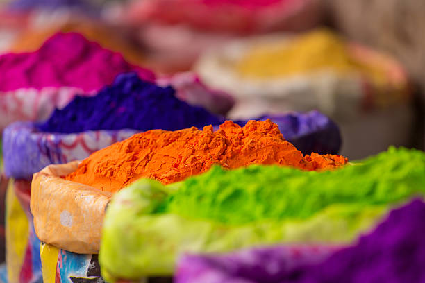 Colorful piles of powdered dyes used for Holi festival stock photo