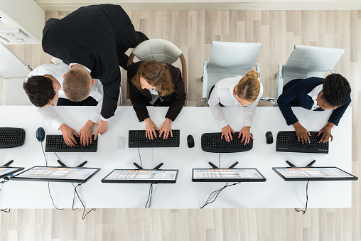 High Angle View Of Businesspeople Together Working In The Office