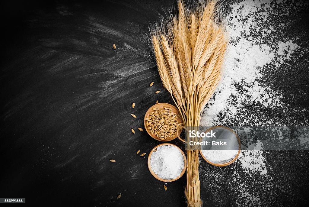 Wheat and flour Wheat and flour on black background Flour Stock Photo