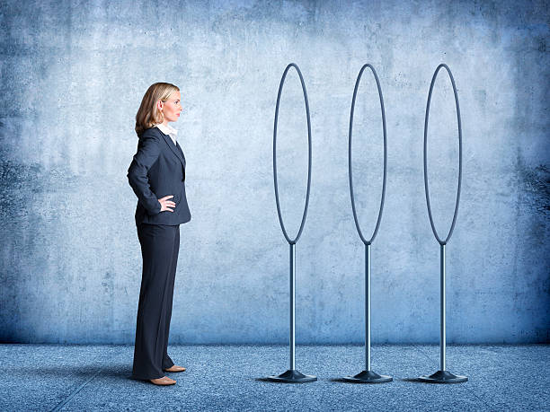 Businesswoman Looks At Multiple Hoops She Must  Jump Through