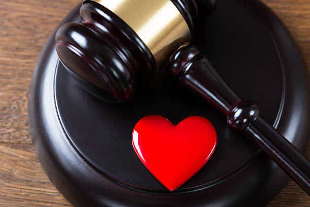 istock Mallet And Heart On Table In Courtroom 583992318