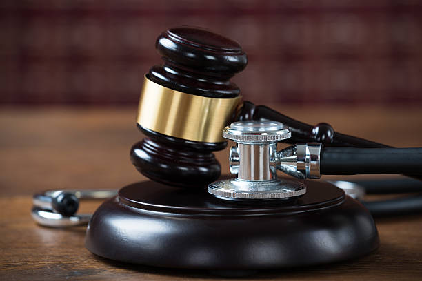 istock Stethoscope And Mallet In Courtroom 583992360