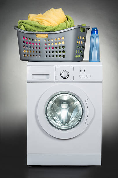 istock Washing Machine With Basket Against Gray Background 583992886