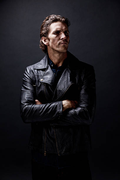 istock Casual man standing with arms crossed 583993540
