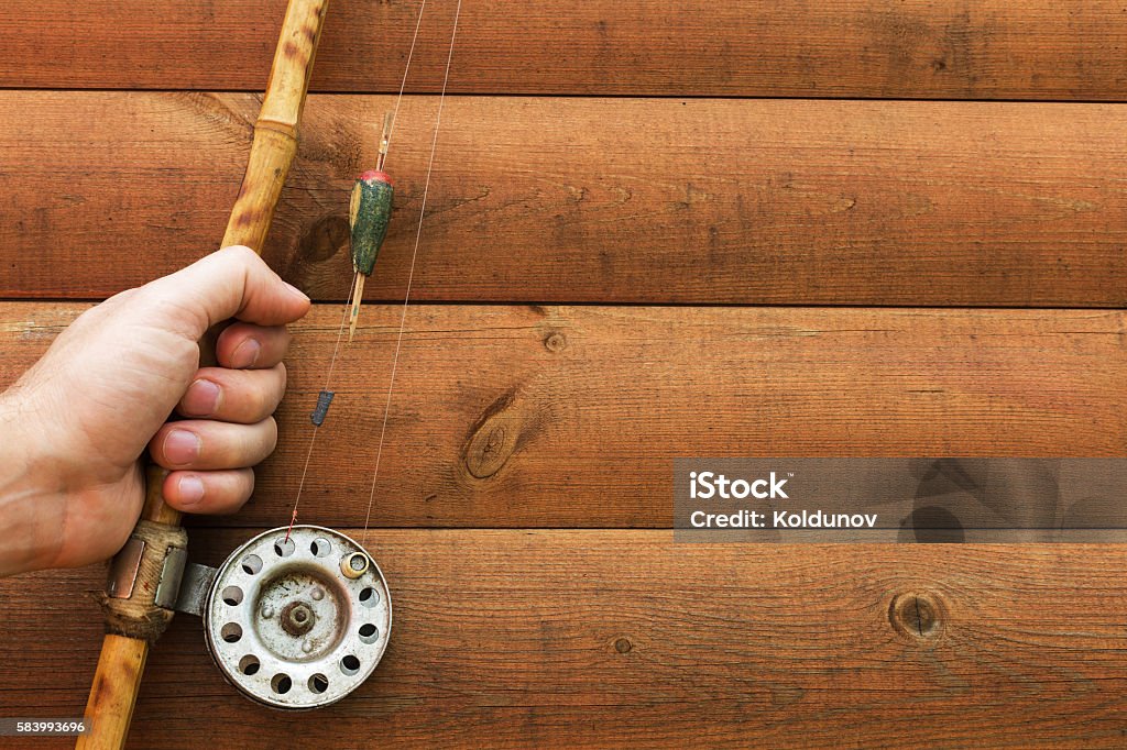 Man Holding Old Fishing Rod In Hands Stock Photo - Download Image Now -  Adult, Catching, Equipment - iStock
