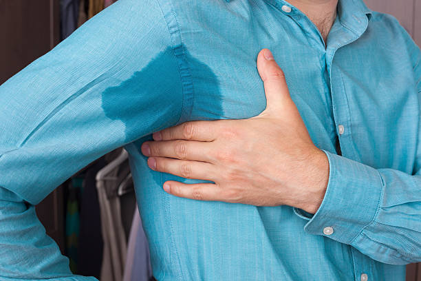 Sweaty spot on the shirt because of the heat, worries Sweaty armpit and a wet spot on his shirt because of the heat underarm stock pictures, royalty-free photos & images