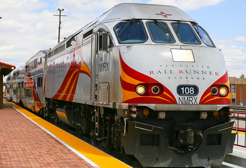 Albuquerque, United States - May 24, 2015: Engine and bilevel cars of the New Mexico Rail Runner Express at the station.