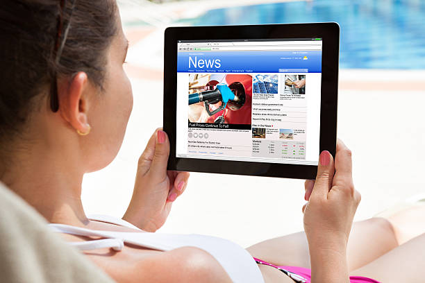 istock Woman Reading News On Digital Tablet 583994492