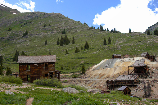 Old mining structures that are all that is remaining of a mining town, now in a National Park