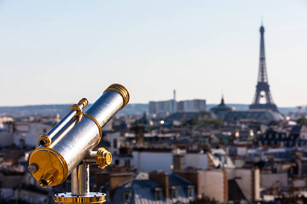 istock Touristic telescope overlooking Eiffel Tower, Paris, France 583994892