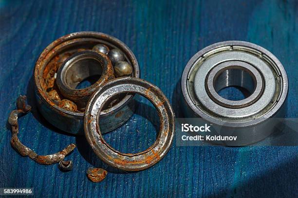 Comparison Of Old And New Bearing Stock Photo - Download Image Now - Ball Bearing, Business Finance and Industry, Chrome