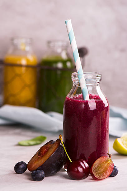 cherry, plum, grapes and blueberry smoothie - plum fruit organic food and drink imagens e fotografias de stock