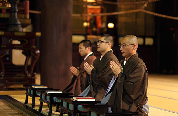 monks praying in temple,chion-ji,kyoto,japan - religion buddha buddhism temple imagens e fotografias de stock