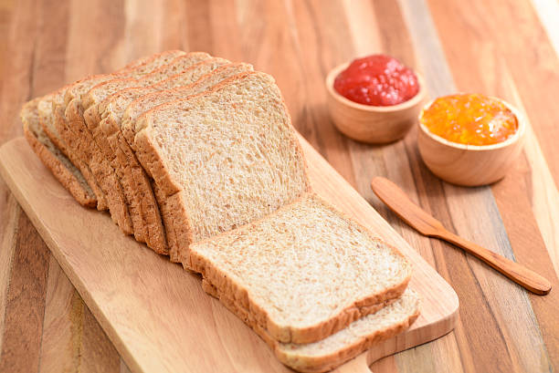 istock slices bread with jam on wooden table 583996596