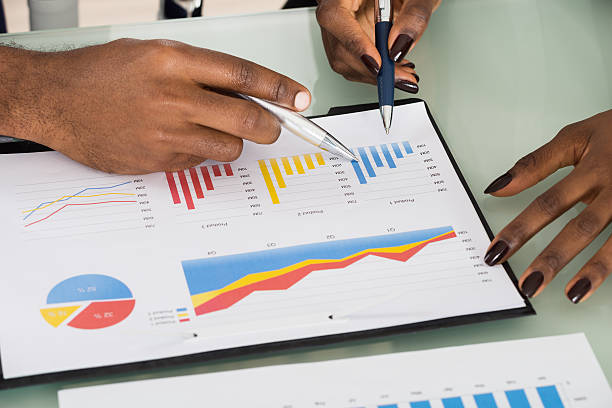 istock Graphs And Charts Analyzed By Businesspeople 583997096