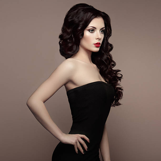 istock Brunette woman with curly hairstyle 584001574