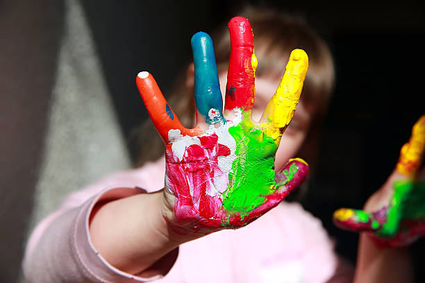 istock Cute little girl with painted hands 584004966