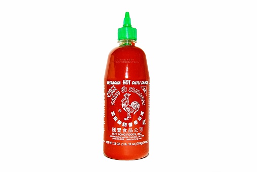 Hagerstown, MD, USA - April 26, 2014: Image of Sriracha Hot Chili Sauce. Sriracha is the most popular hot sauce made by Huy Fong Foods, Inc. 