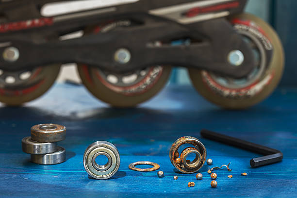 istock Replacing a broken wheel bearing on a scooter or roller 584006114