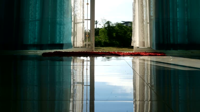 curtain blowing in the wind at hot summer day