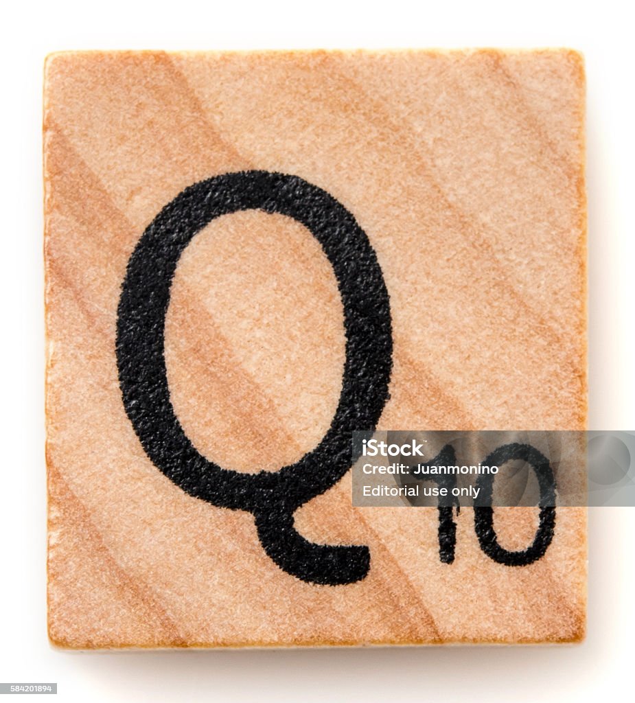 Letter Q Miami, Florida, USA - December 7, 2015: Scrabble game board Lettered wooden tile showing the letter Q. Scrabble is a fun and educational game distributed by Hasbro Scrabble Stock Photo