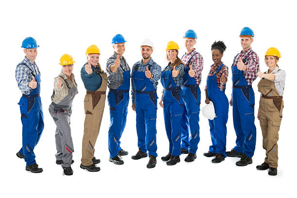 istock Confident Carpenters Standing In Row 584203204