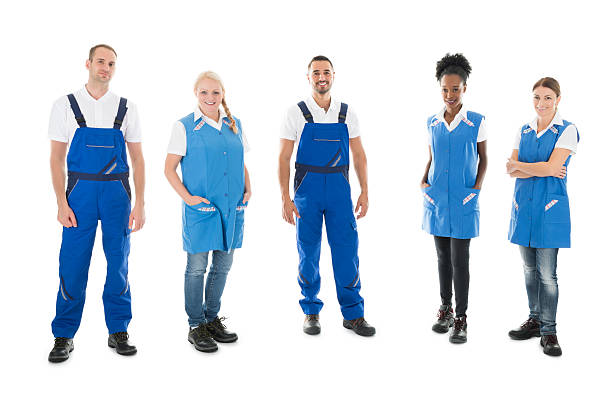 ritratto di fiduciosi bidelli multietnici in fila - manual worker full length isolated on white standing foto e immagini stock