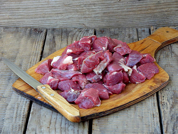 istock Fresh and raw meat, cut into slices with knife 584204706