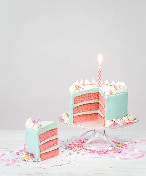 istock Pastel Blue Birthday Cake with Pink Layers 584205028