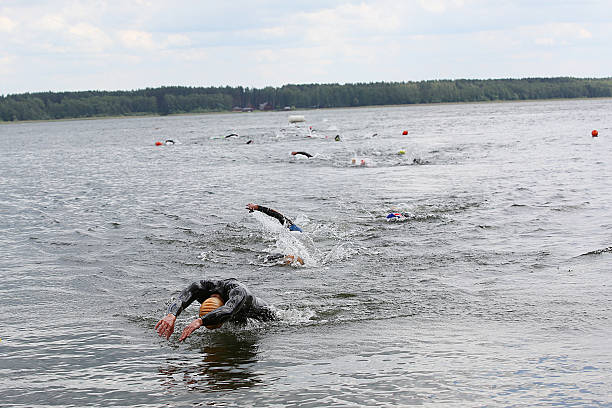 istock Swimming athletes in a triathlon contest 584205322