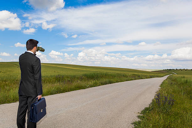 istock Businessman with binocular on travel 584205606