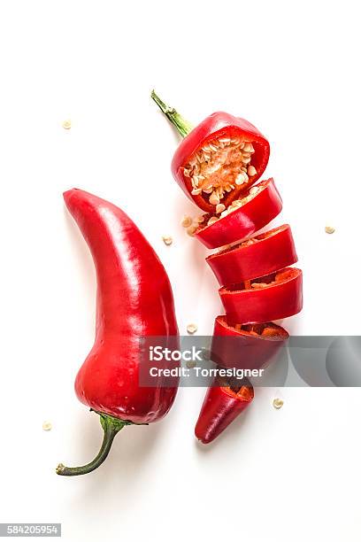 Red Chili Peppers Sliced On White Background Stock Photo - Download Image Now - Chili Pepper, Pepper - Vegetable, White Background