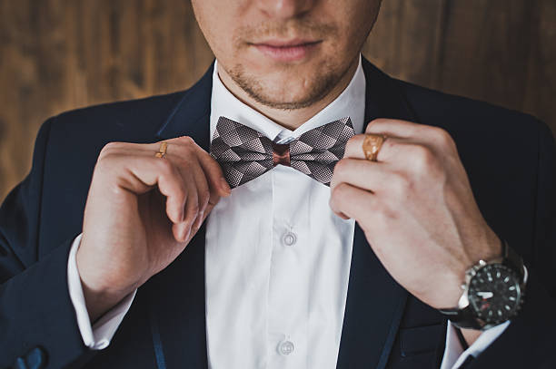 istock Male hands adjusting the tie 584206528
