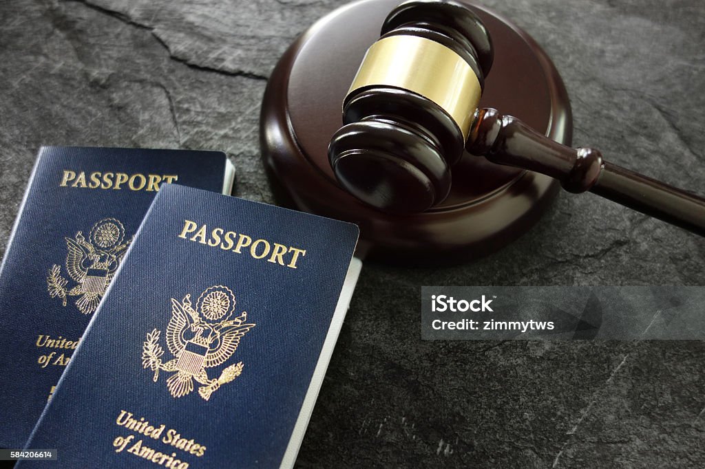 Gavel and passports US passports and judges legal gavel Emigration and Immigration Stock Photo