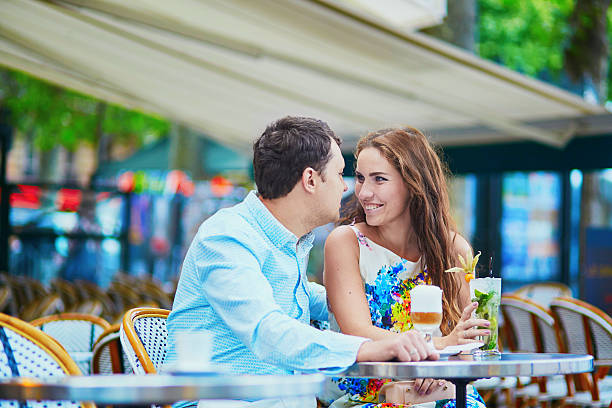 istock Happy romantic couple in Parisian cafe 584207086