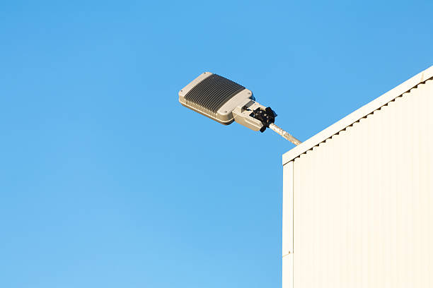istock Modern industrial lamp on a building against sky. 584207136
