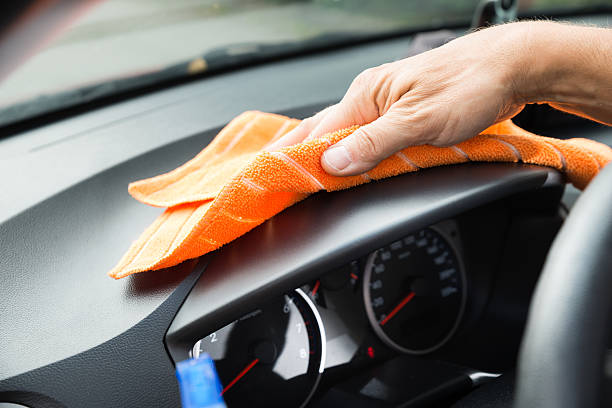 istock Male Worker Cleaning Car Dashboard 584207282