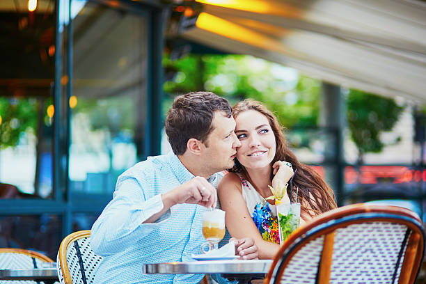 istock Happy romantic couple in Parisian cafe 584207396