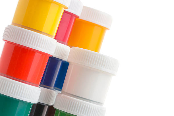 istock Close-up of gouache paint cans on white background 584207468