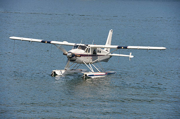istock Seaplane taxiing on water 584209608