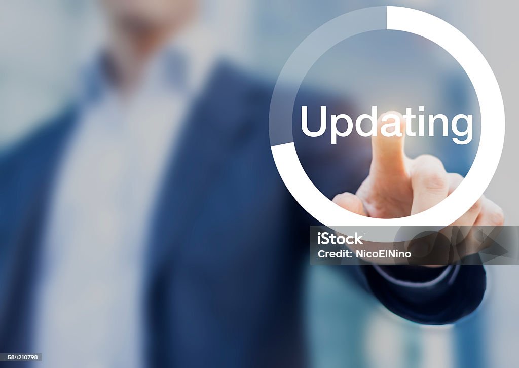 Software updating button with person touching button on the screen Concept about software updating with a person touching a progress button on a computer interface Improvement Stock Photo