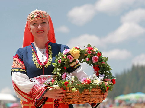 Rozhen, Bulgaria - July 15, 2016: Woman in traditional folk costume of famous rozhen folklore festival in bulgaria
