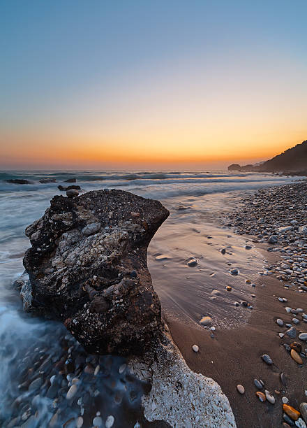 istock Rocky coastline at sunset 584213928