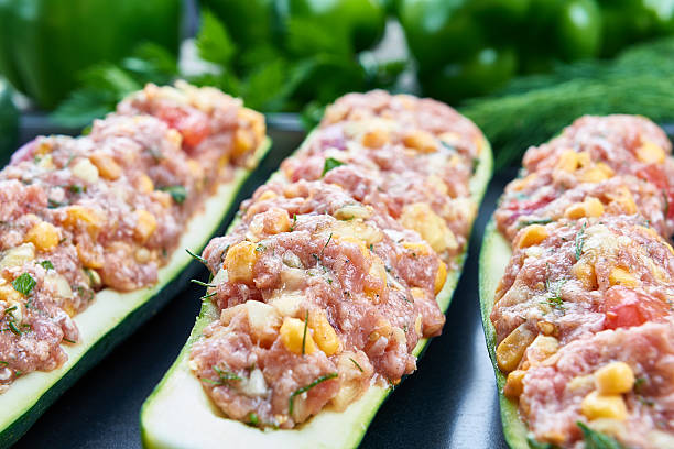 istock Raw courgettes stuffed with meat and vegetables 584214270
