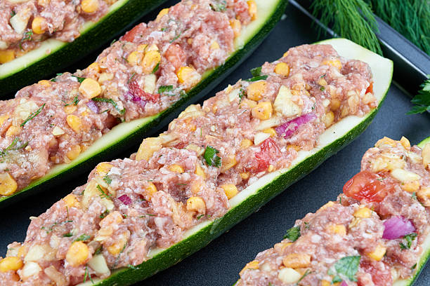 istock Raw courgettes stuffed with meat and vegetables 584214324