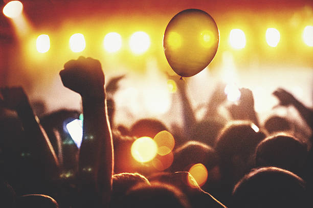 istock People at concert party. 584214404