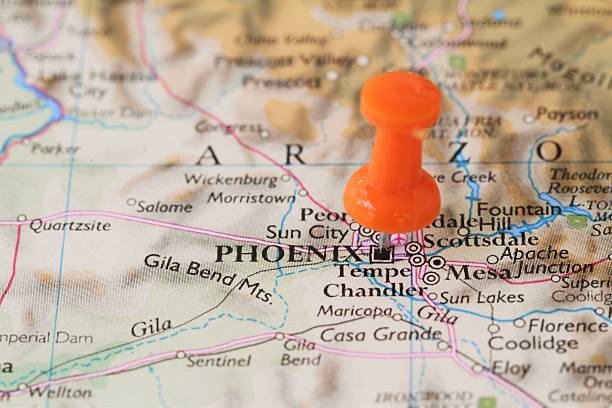 Push pin on map of  Phoenix, Arizona, USA Macro shot of stick pin on map of Phoenix, Arizona, USA. Many other smaller towns, such as Tempe, Mesa and Scottsdale are also visible.  Travel and vacation destination. Phoenix is the state capital of Arizona. tempe arizona stock pictures, royalty-free photos & images